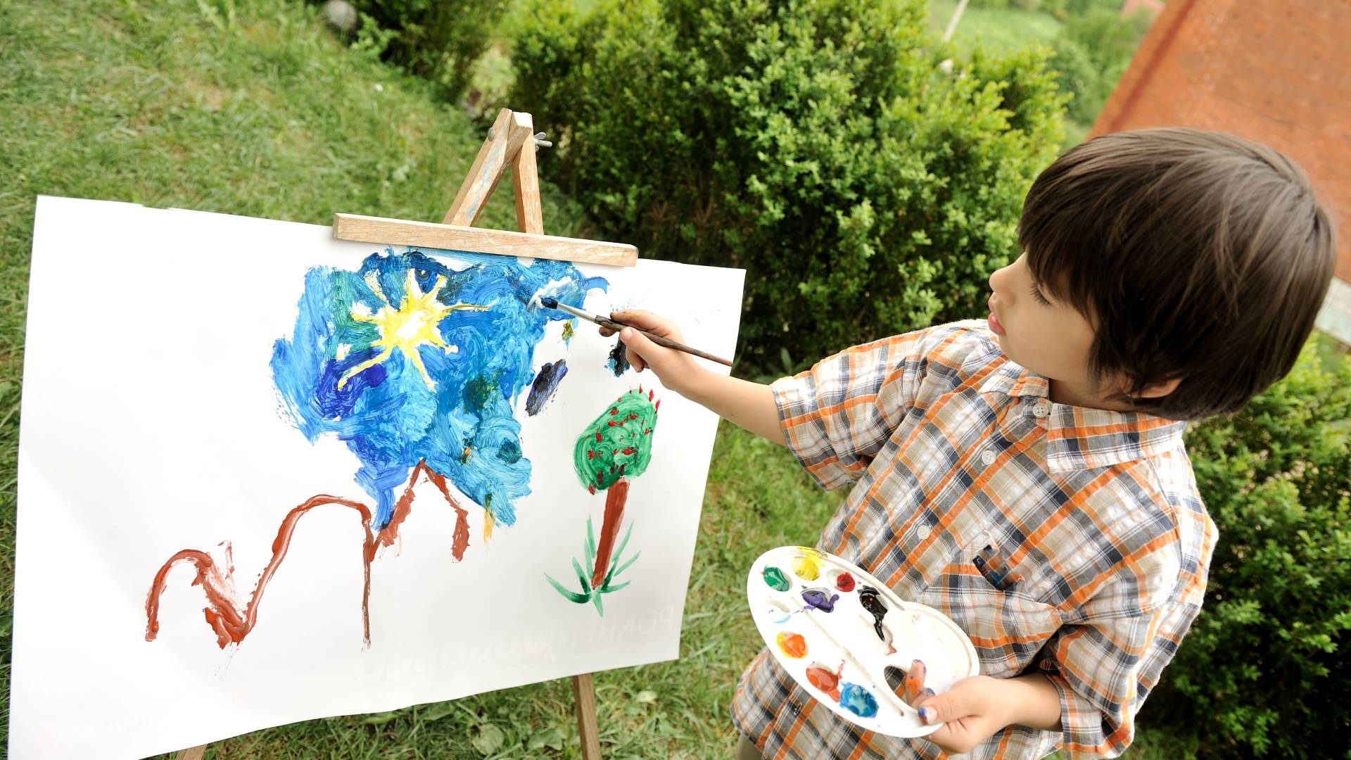 child painting with watercolor